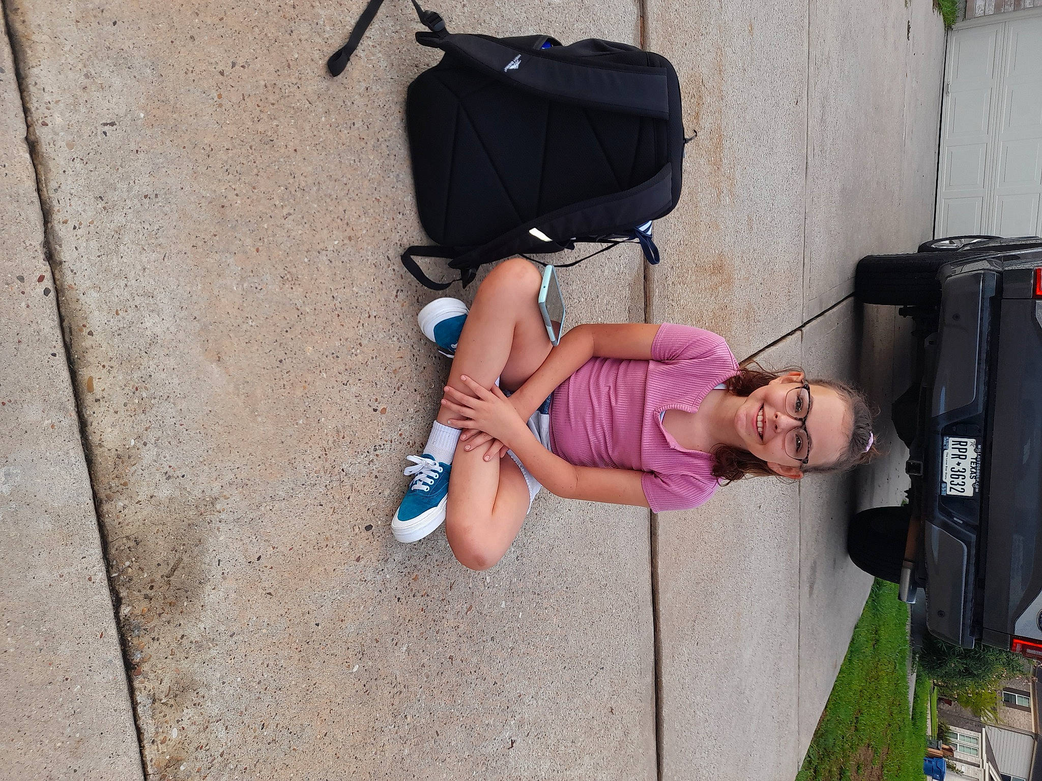 Eliza is registered to the contest to win money with this photo: baby_products, bag, car, fashion_accessory, foot, fun, human_leg, joy, luggage_and_bags, magenta, person, plant, sandal, sidewalk, street, thigh, tire, toddler, travel, vehicle_door