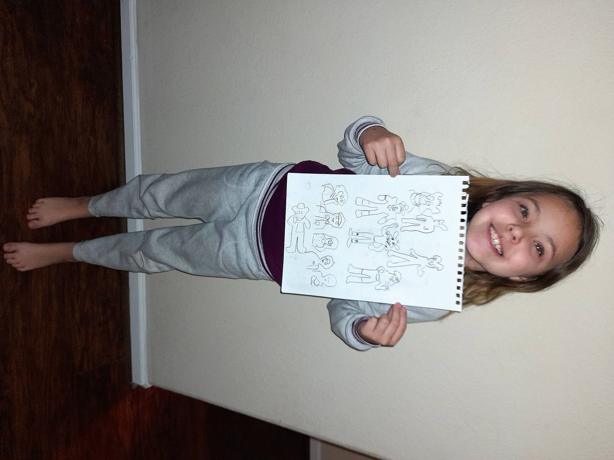 Eliza joined the competition — help win amazing prizes! balance, comfort, elbow, flooring, font, handwriting, happy, hardwood, human_leg, joy, knee, person, room, sleeve, smile, thigh, walking_shoe, wood, wrist, writing