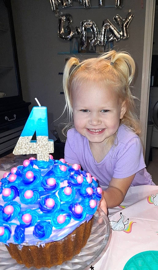 Amaya is registered to the contest to win money with this photo: baked_goods, birthday, birthday_cake, blue, cake, cake_decorating, cake_decorating_supply, event, food, fun, happy, joy, person, picture_frame, purple, smile, sugar_cake, sugar_paste, sweetness, table