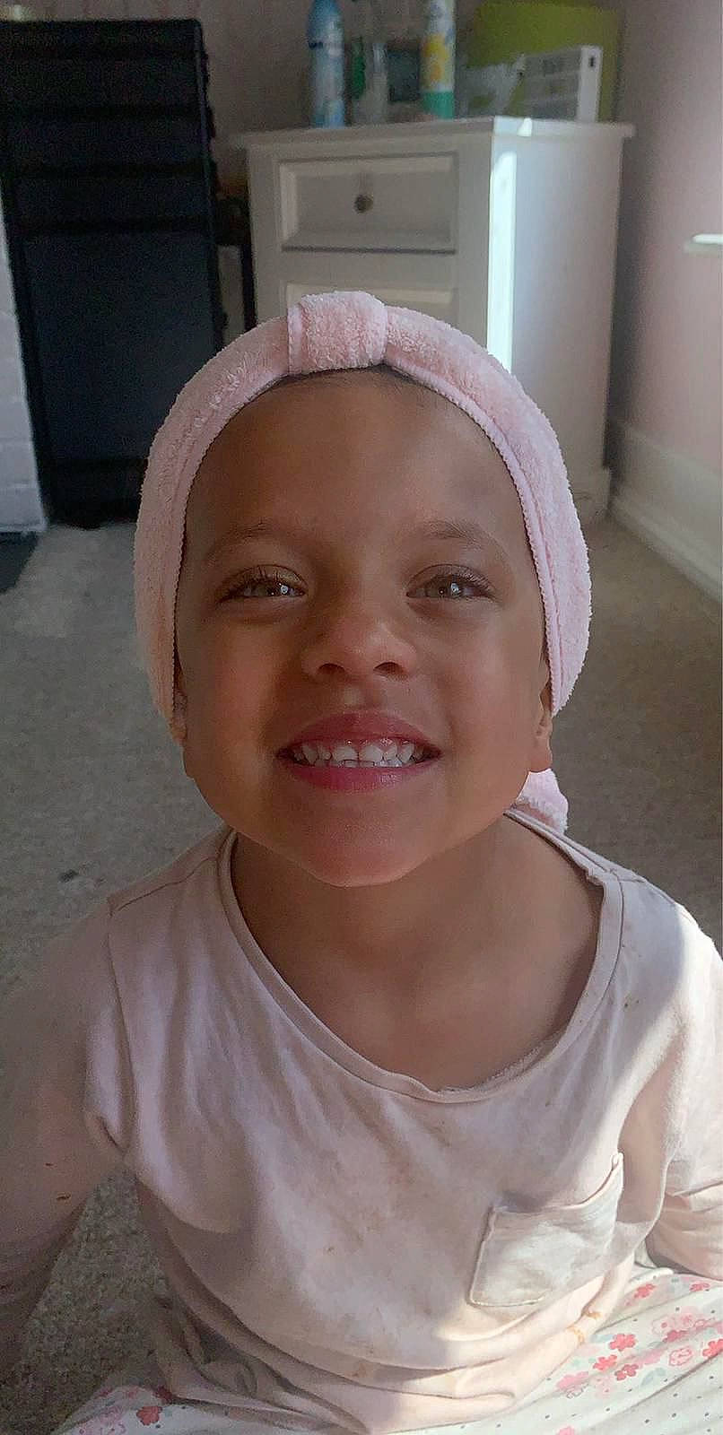 Ebony is registered to the contest to win money with this photo: cheek, chin, eye, eyebrow, eyelash, forehead, hair, happy, iris, jaw, joy, lip, mouth, neck, nose, person, pink, skin, sleeve, smile