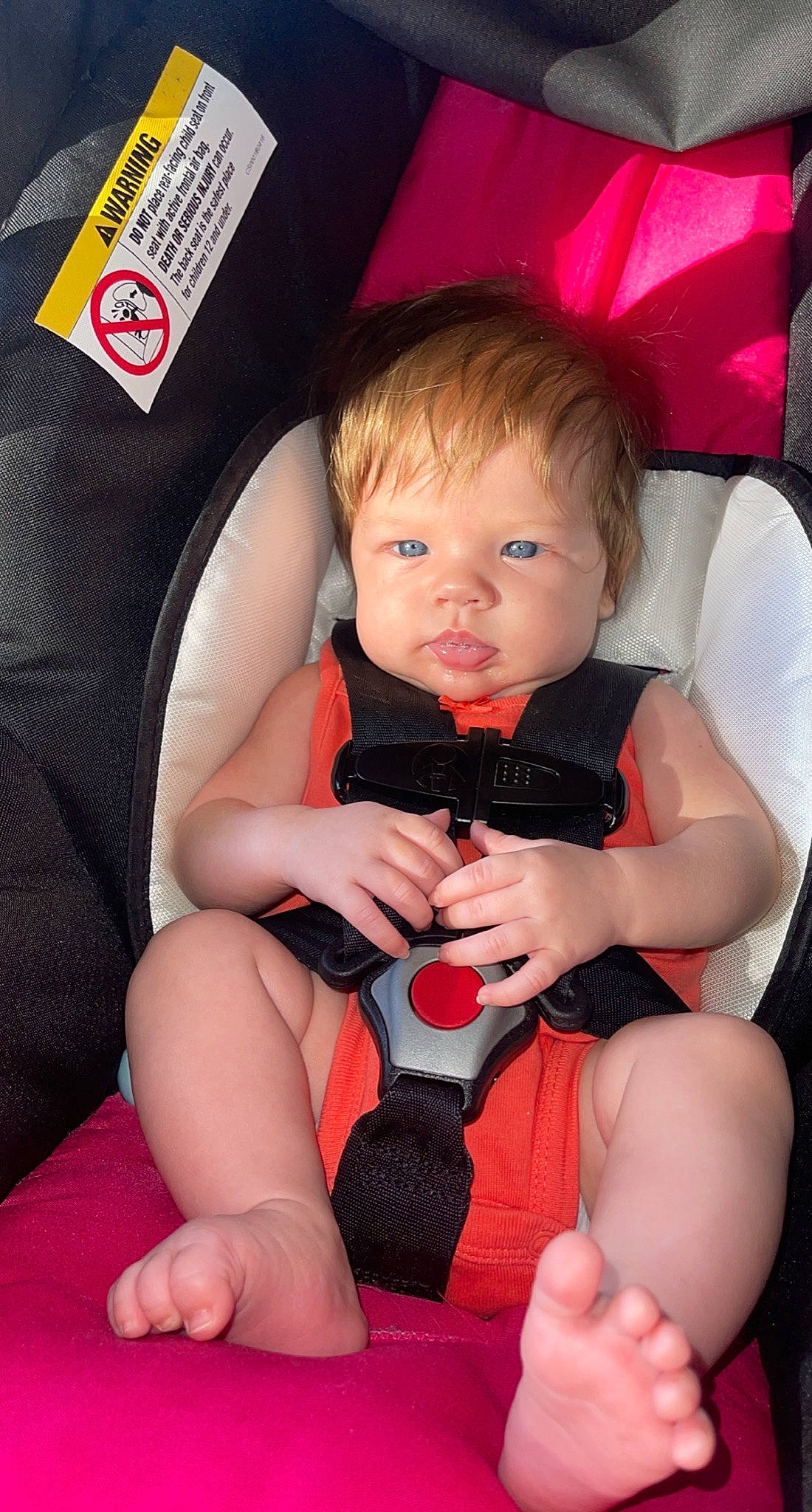 Taytum is registered to the contest to win money with this photo: arm, baby_toddler_clothing, chair, cheek, chin, comfort, eye, finger, flash_photography, gesture, hand, human_body, joint, lap, leg, mouth, person, pink, skin, stomach