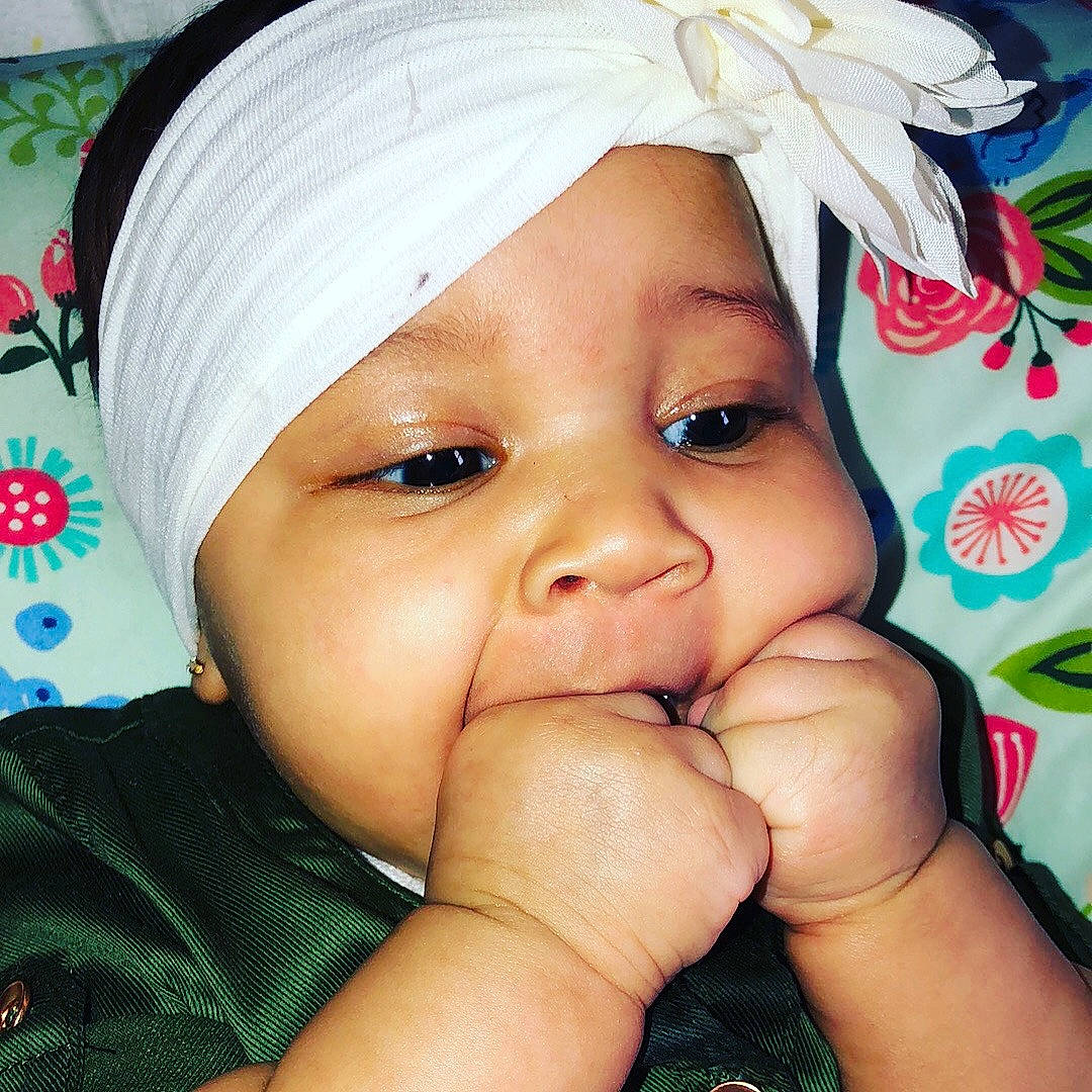 Stormee is registered to the contest to win money with this photo: beauty, black_hair, cheek, child, eye, eyebrow, face, finger, girl, hair_accessory, hand, happiness, head, headgear, infant, lip, mouth, nose, person, skin