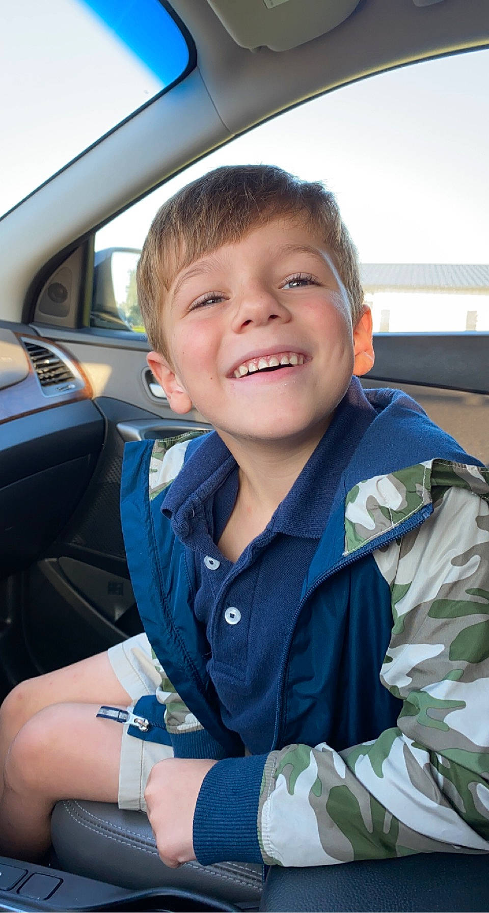Paxton joined the competition — help win amazing prizes! auto_part, automotive_design, automotive_exterior, car, car_seat, car_seat_cover, child, electric_blue, face, family_car, head_restraint, joy, luxury_vehicle, military_camouflage, motor_vehicle, person, personal_luxury_car, smile, steering_wheel, toddler