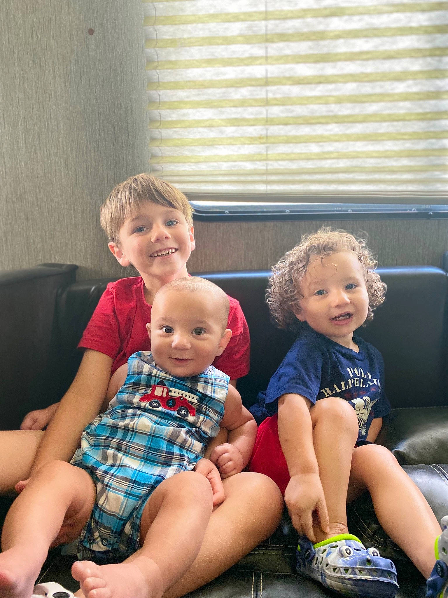 Jamerson is registered to the contest to win money with this photo: baby_toddler_clothing, child, comfort, couch, finger, fun, hairstyle, happy, joy, lap, leg, people, person, shorts, skin, smile, standing, t_shirt, thigh, toddler