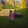 arch, celebration, child, colorful_lights, decoration, festive, festivity, fun, grass, holiday_lights, illumination, leggings, night, outdoor, person, pink_hoodie, toddler, toy, walking, winter