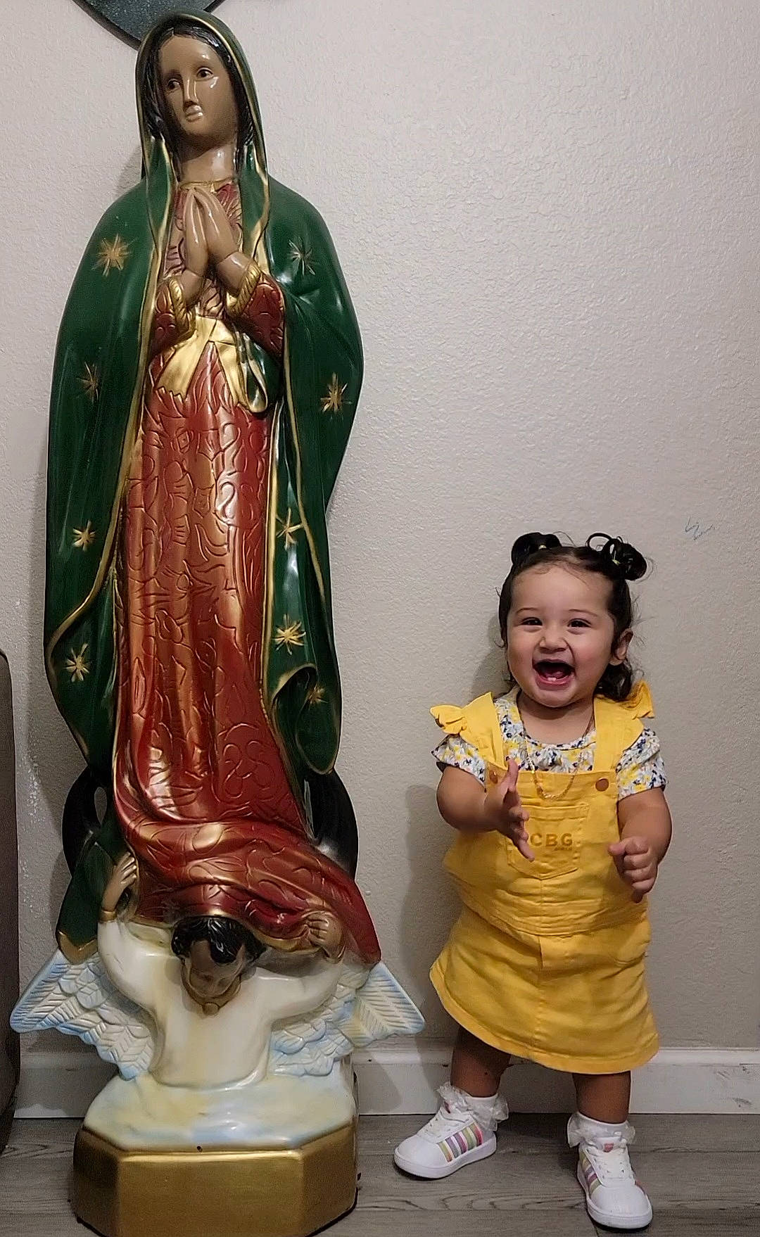 Paola is registered to the contest to win money with this photo: art, artifact, baby_toddler_clothing, bronze_sculpture, carving, classical_sculpture, event, fun, hairstyle, happy, head, metal, monument, person, sculpture, smile, standing, statue, temple, toddler