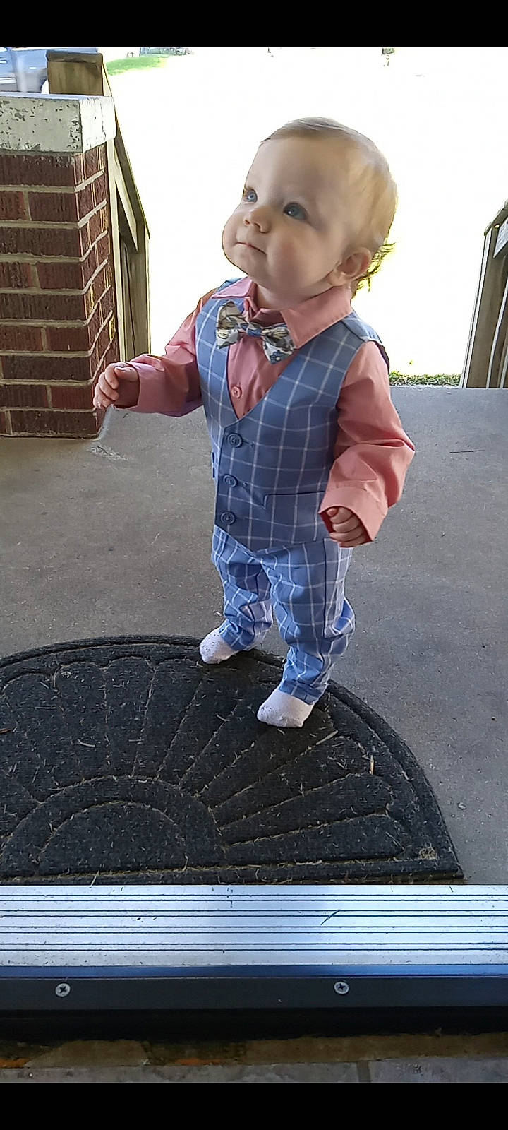 Dwayne is registered to the contest to win money with this photo: asphalt, automotive_tire, baby, baby_toddler_clothing, brick, brickwork, child, concrete, electric_blue, flooring, fun, grass, pattern, person, plaid, road_surface, sleeve, snapshot, soil, tartan