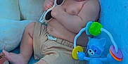 Liam Caleb Herrera joined the competition — help win amazing prizes! baby, child, sunglasses, stuffed_toy, teddy_bear, toy, blue, shirtless, shorts, indoor, chair, infant, cute, relaxed, playful, person, smiling, hand, foot, face