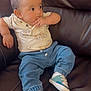 Liam Caleb Herrera joined the competition — help win amazing prizes! baby, infant, child, sitting, leather_chair, blue_jeans, elephant_pattern, shirt, sneakers, footwear, hand_on_mouth, cute, casual_clothing, indoor, portrait, young_child, curious, relaxed, furniture, small_shoes