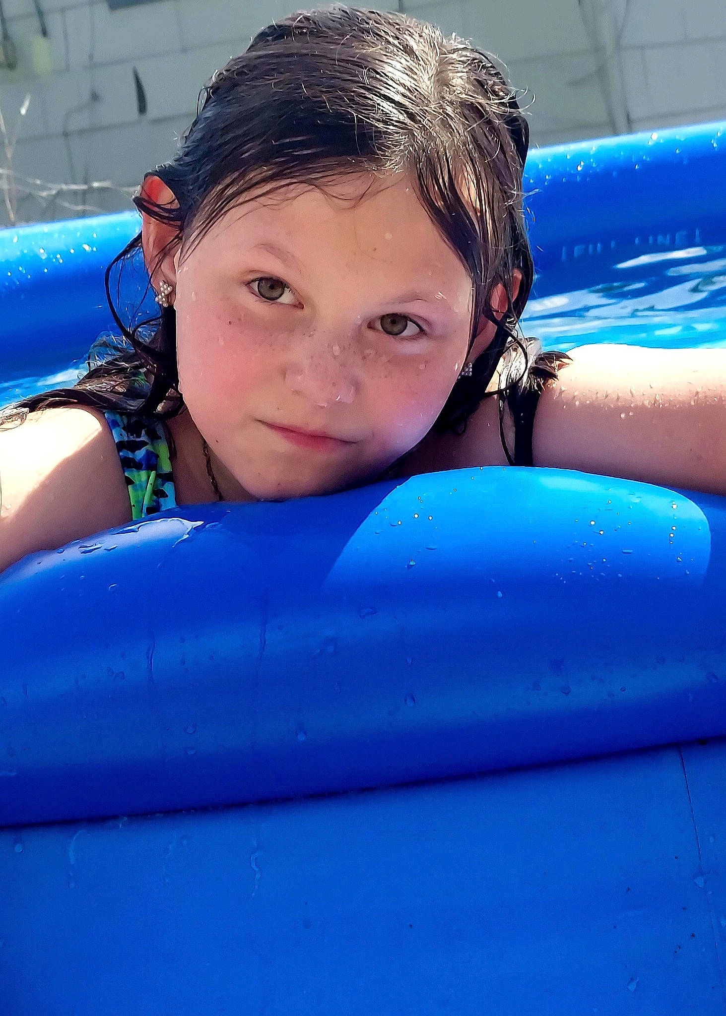 Aubree is registered to the contest to win money with this photo: automotive_exterior, blue, boats_and_boating_equipment_and_supplies, bumper, child, electric_blue, fun, games, happy, inflatable, leisure, person, personal_protective_equipment, plastic, recreation, swimming_pool, vacation, water, water_park