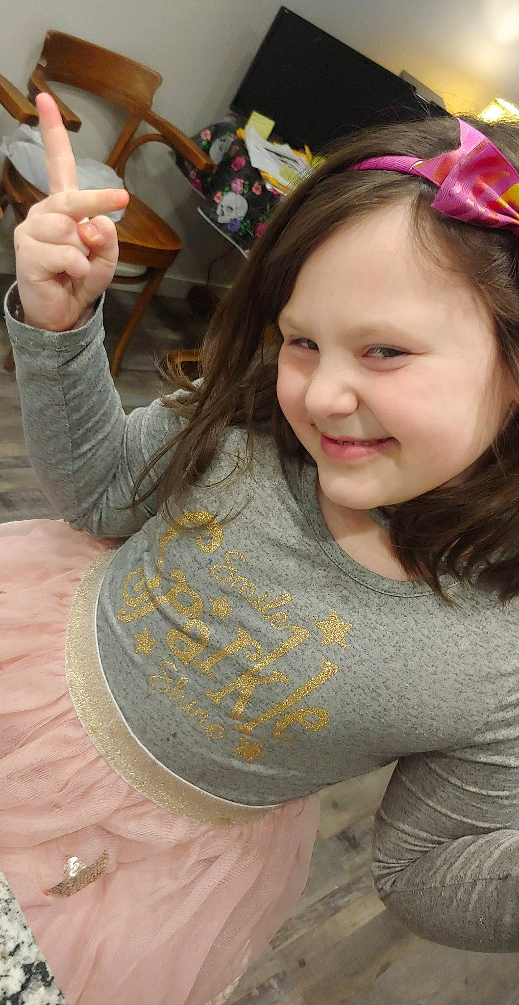 Aubree is registered to the contest to win money with this photo: beauty, brown_hair, cool, event, fun, gesture, happy, human, joy, leisure, lip, long_hair, neck, people, person, sign_language, skin, smile, t_shirt, thumb