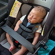 Cyrus joined the competition — help win amazing prizes! baby, sleeping, car_seat, safety_harness, infant, child, seatbelt, clothing, foot, head, peaceful, resting, indoors, transportation, safety, toddler, cute, young_child, seat, relaxation