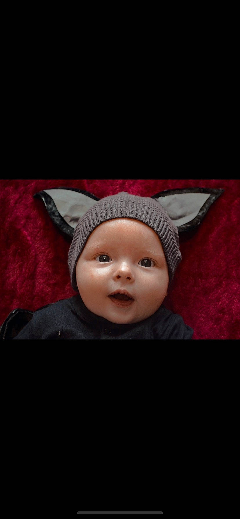 Kayne is registered to the contest to win money with this photo: art, baby, baby_toddler_clothing, beanie, bonnet, cap, child, costume_accessory, costume_hat, darkness, fashion_accessory, flash_photography, happy, headwear, laugh, magenta, person, portrait_photography, smile, toddler