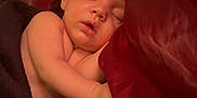 Bellamy is registered to the contest to win money with this photo: arm, baby, bed, blanket, child, closeup, comfort, cozy, cute, face, indoors, infant, peaceful, pillow, portrait, relaxation, rest, skin, sleeping, soft