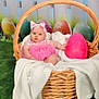 baby, basket, blanket, pink, easter_egg, headband, grass, decorative_eggs, wicker, child, infant, clothing, outdoor_scene, picket_fence, cute, portrait, holiday, spring, toddler, soft_toy