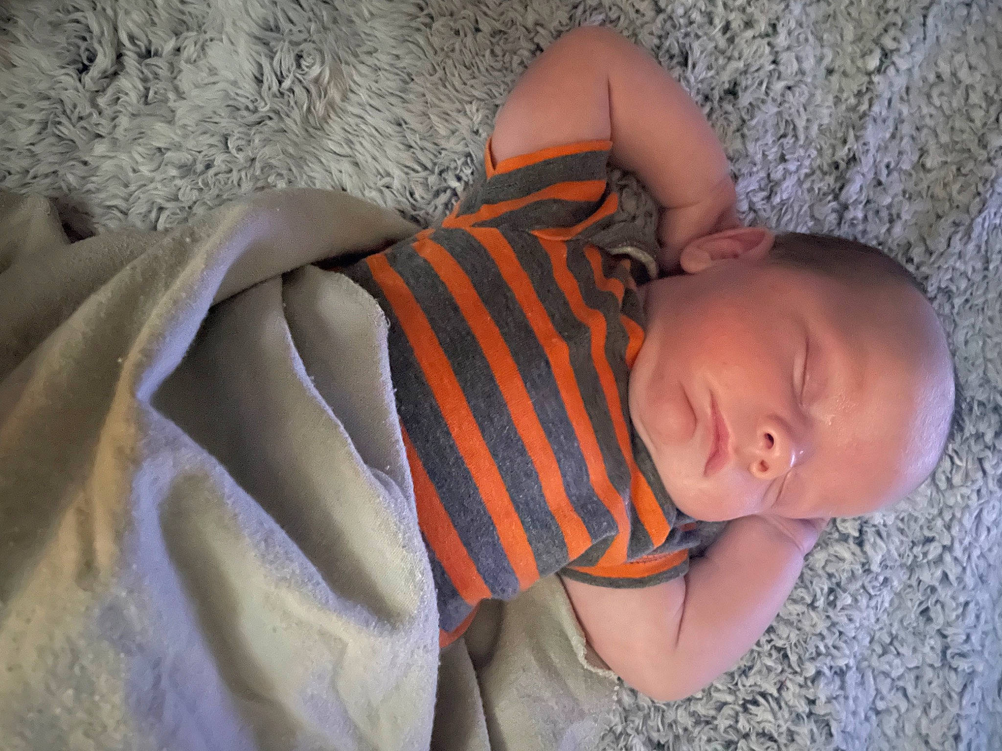 Ryder joined the competition — help win amazing prizes! baby, baby_toddler_clothing, bedtime, child, comfort, finger, headgear, linens, mouth, nap, nose, orange, pattern, person, room, sitting, skin, textile, toddler, tree