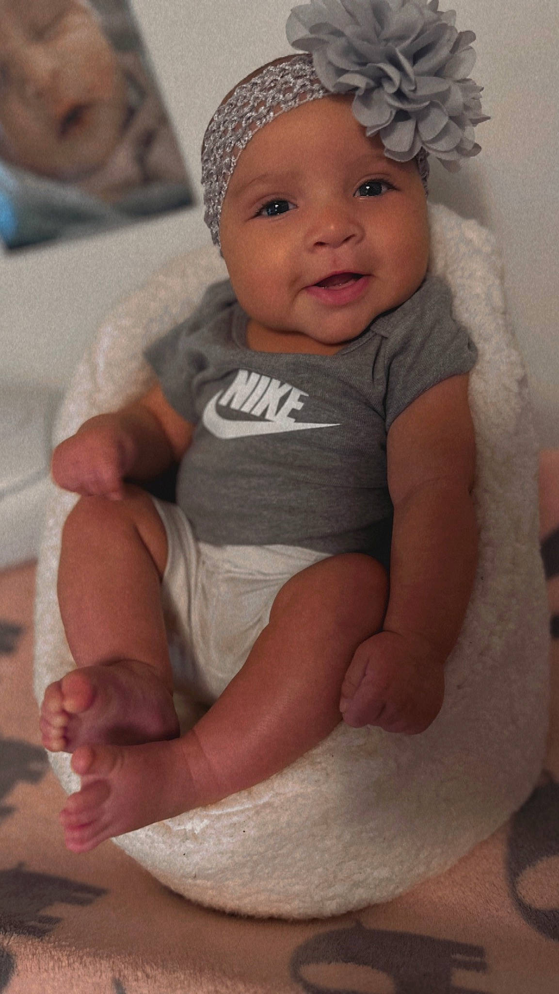 Zaylin Grace is registered to the contest to win money with this photo: baby, baby_toddler_clothing, cap, cheek, chin, comfort, eye, finger, hand, happy, headband, headgear, headwear, human, iris, lip, organ, person, pink, skin