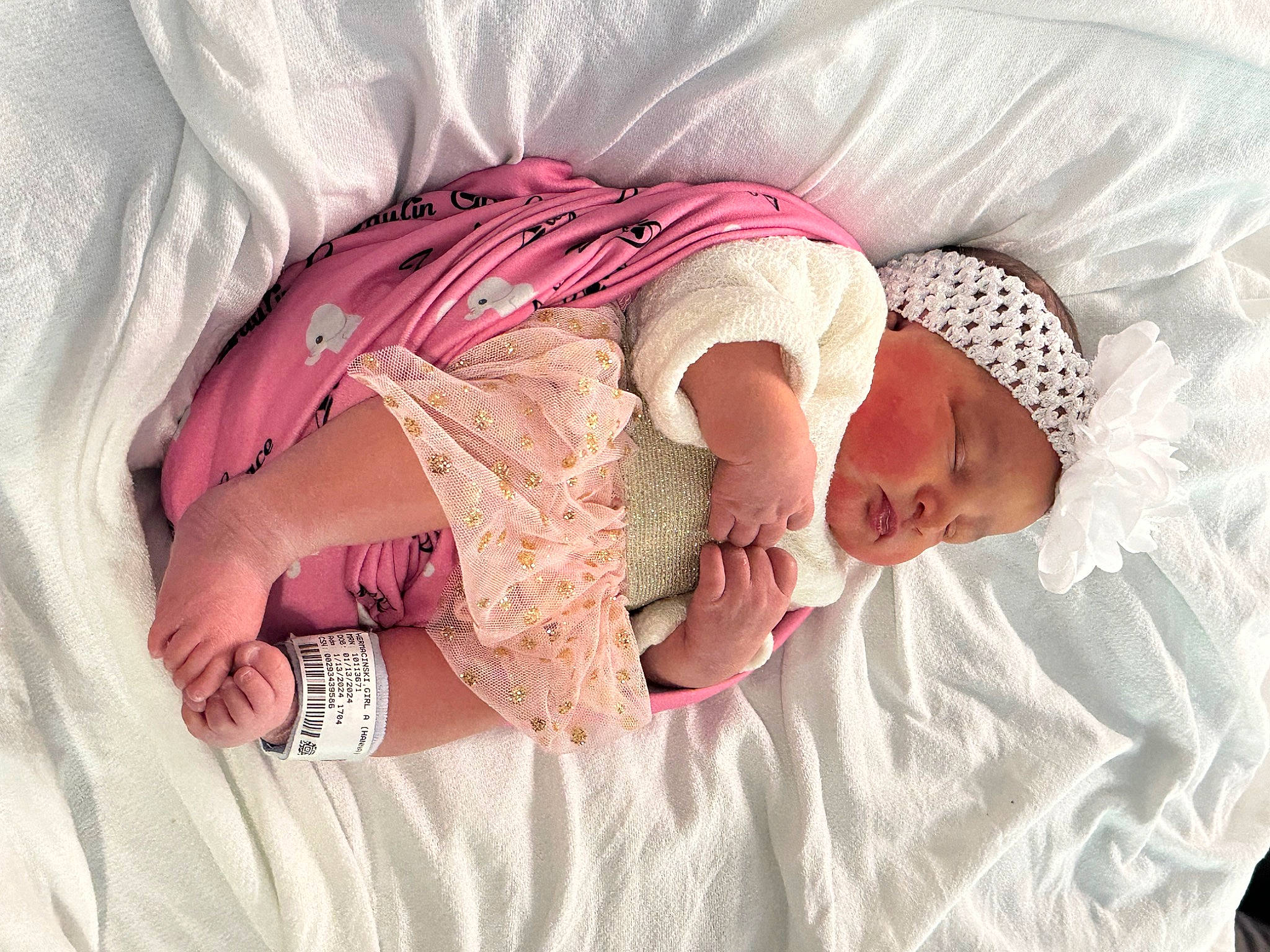 Zaylin is registered to the contest to win money with this photo: arm, baby, baby_products, baby_sleeping, baby_toddler_clothing, bed, bedding, bedtime, child, comfort, finger, hand, human_body, leg, linens, person, pink, product, skin, sleeve