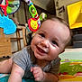 baby, background, bright, cheerful, child, clothing, colorful, crawling, cute, development, face, furniture, happy, home, indoor, infant, person, play_mat, smiling, toy