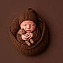 newborn, baby, sleeping, knitted, brown, blanket, hat, teddy_bear, crocheted, cozy, wrapped, cute, infant, portrait, soft, peaceful, child, monochrome, studio, hands