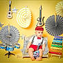 baby, child, toy_guitar, toy_microphone, xylophone, miniature_couch, musical_instruments, decorations, yellow_background, red_hat, red_bow_tie, red_shorts, white_shirt, polka_dots, stars, drum_set, colorful, indoor, portrait, cute