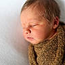 Sebastian joined the competition — help win amazing prizes! newborn, baby, sleeping, wrapped, blanket, soft_hair, face, peaceful, closeup, portrait, infant, texture, brown, white_background, rest, calm, cute, child, cozy, indoors