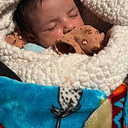 Caspain is registered to the contest to win money with this photo: architecture, baby, bed, blanket, bodypart, cushion, face, finger, furniture, hand, head, homedecor, newborn, person, photography, plush, portrait, quilt, sleeping, toy