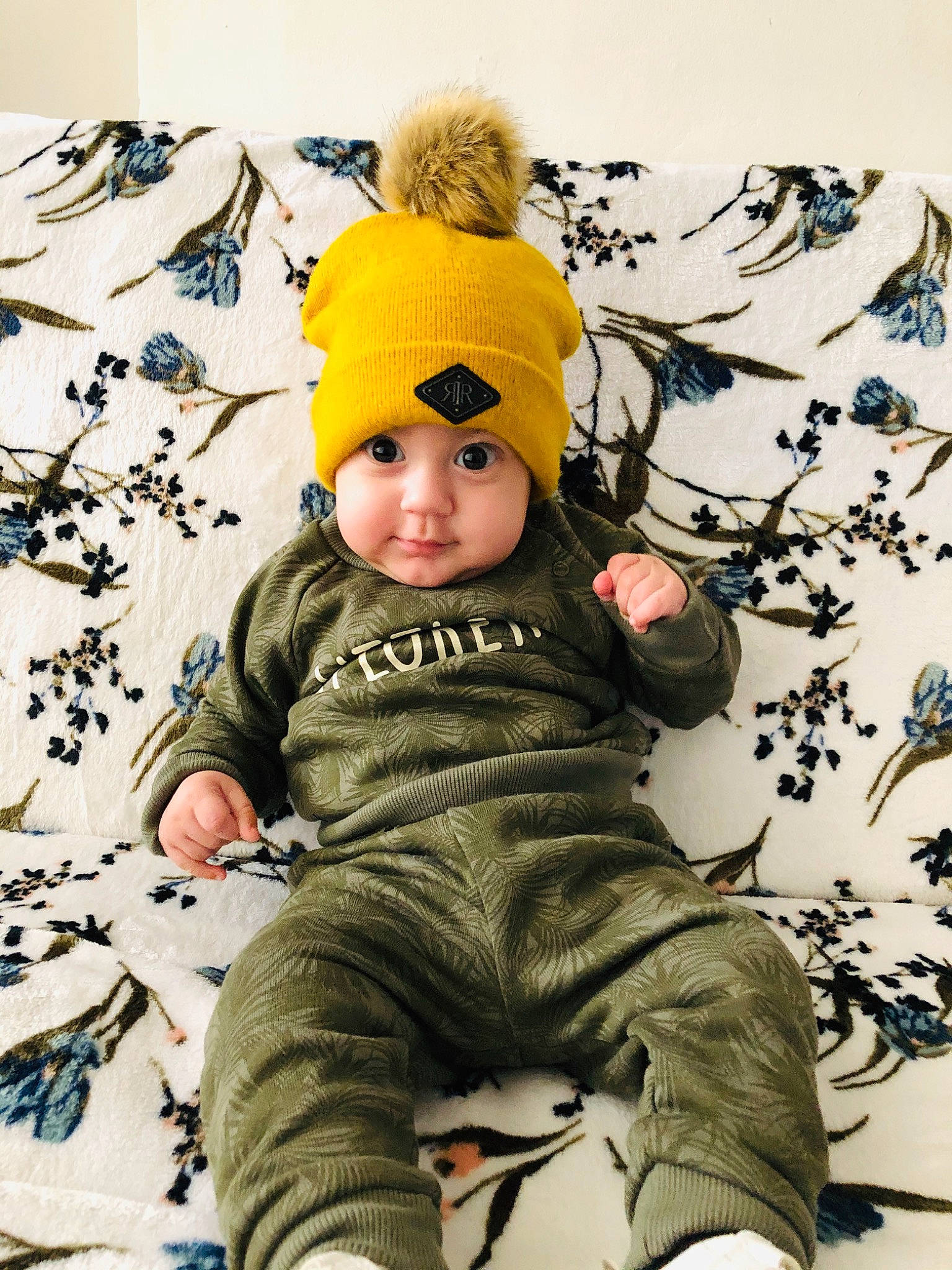 Andreas joined the competition — help win amazing prizes! baby, beanie, cap, child, headgear, headwear, knit_cap, leaf, outerwear, person, sitting, sleeve, toddler