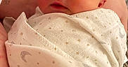 Samir is registered to the contest to win money with this photo: newborn, baby, sleeping, blanket, swaddle, arm, hand, face, infant, peaceful, soft_light, closeup, indoor, person, cute, wrapped, tender, newborn_baby, resting, gentle