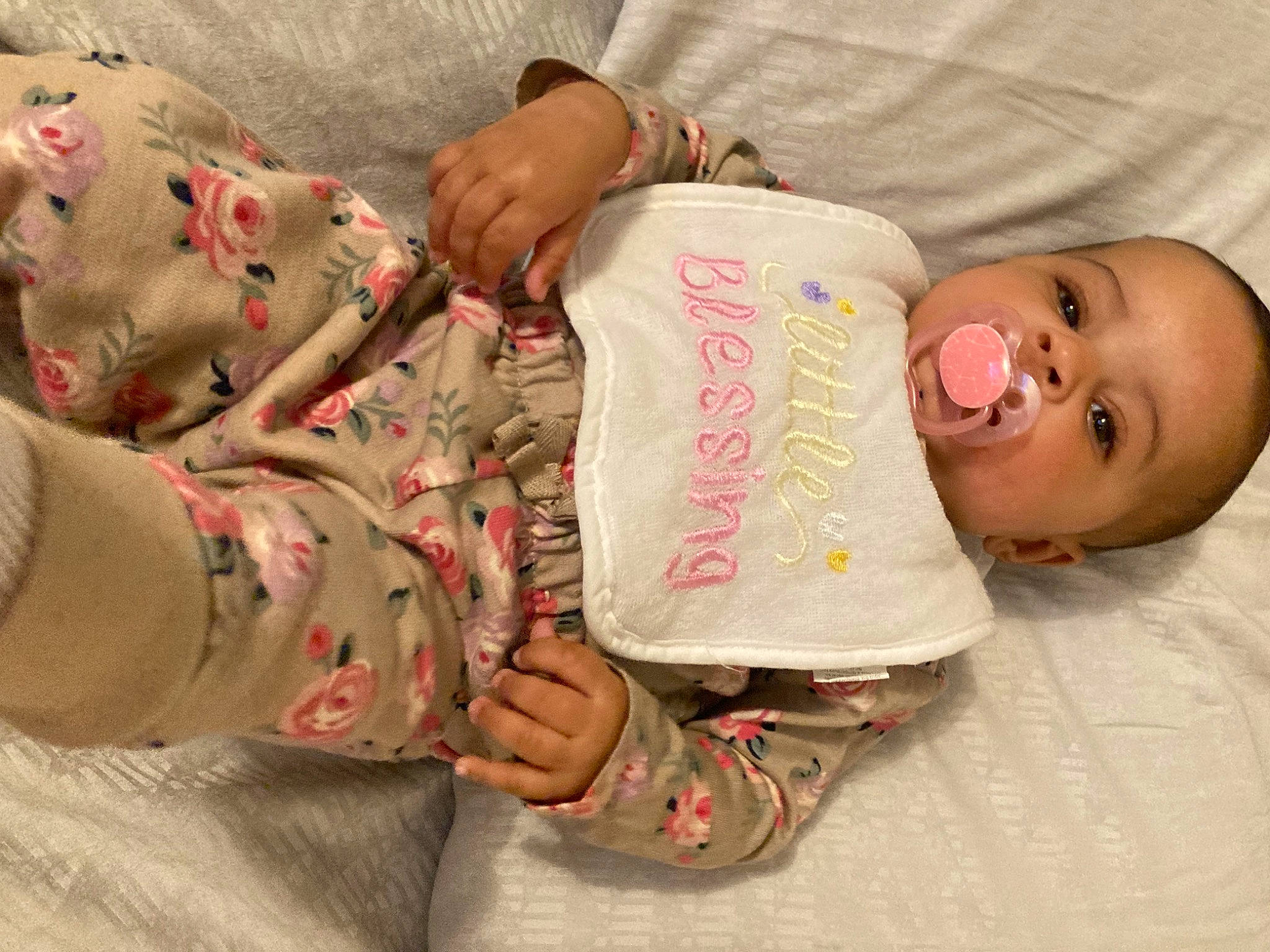 Kaylani joined the competition — help win amazing prizes! arm, baby, baby_toddler_clothing, bedtime, cheek, child, comfort, finger, hand, human_body, leg, linens, nail, pattern, person, pink, room, skin, sleeve, textile