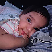 Braylee is registered to the contest to win money with this photo: baby, infant, face, thumb_sucking, lying_down, blanket, pillow, cute, child, soft_fabric, dark_background, closeup, sleepy, cozy, comfort, portrait, expression, indoors, young, peaceful