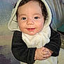 baby, child, smiling, panda_outfit, hooded_clothing, cute, portrait, indoors, hands, face, blue_eyes, curly_hair, soft_texture, warm_clothing, infant, happy, close_up, person, cozy, toddler