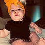 baby, child, headwrap, orange, bow, black_shirt, shorts, barefoot, sitting, curious, indoor, soft_lighting, chubby, wide_eyes, cute, infant, pale_skin, portrait, closeup, bed