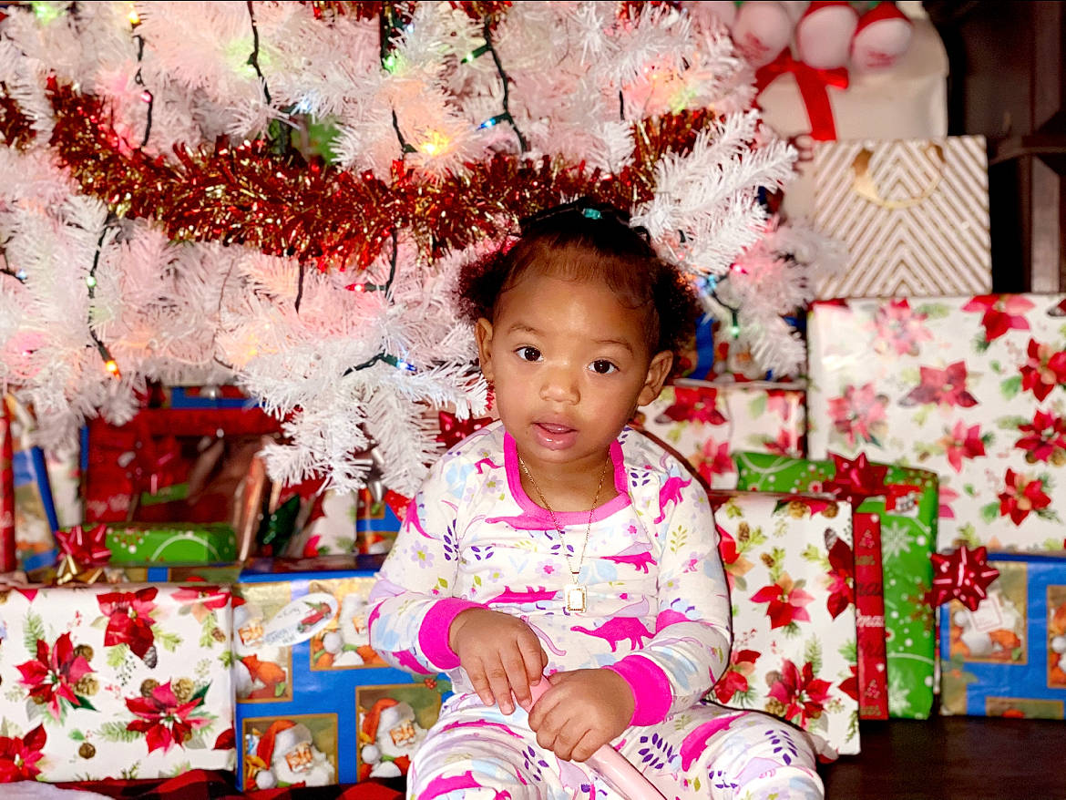 Tamiko is registered to the contest to win money with this photo: baby, baby_toddler_clothing, child, christmas, holiday, home_accessories, interior_design, ornament, paint, person, pink, toddler