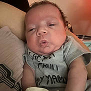 Maverick joined the competition — help win amazing prizes! arm, baby, closeup, clothing, comfort, couch, cute, expression, face, indoors, infant, mittens, newborn, person, pillow, portrait, resting, skin, sleepy, soft