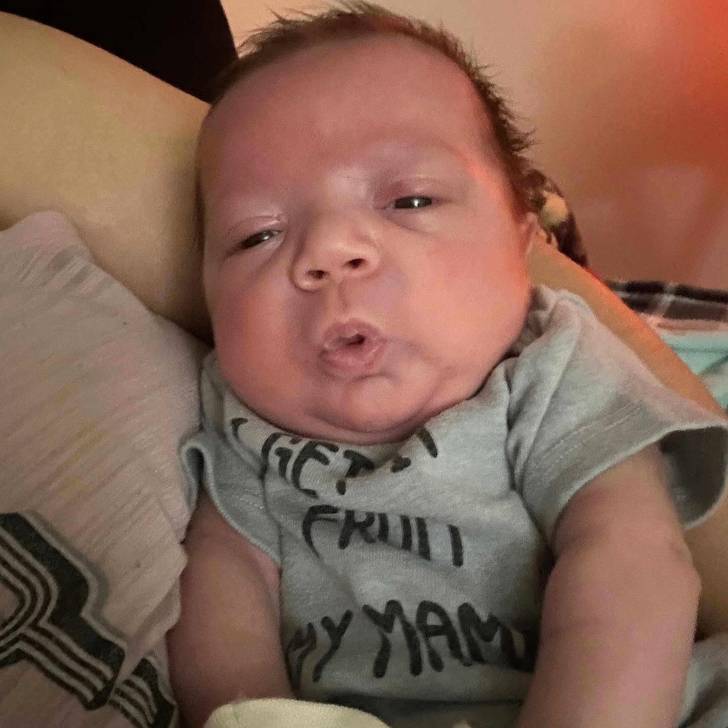 Maverick joined the competition — help win amazing prizes! arm, baby, closeup, clothing, comfort, couch, cute, expression, face, indoors, infant, mittens, newborn, person, pillow, portrait, resting, skin, sleepy, soft