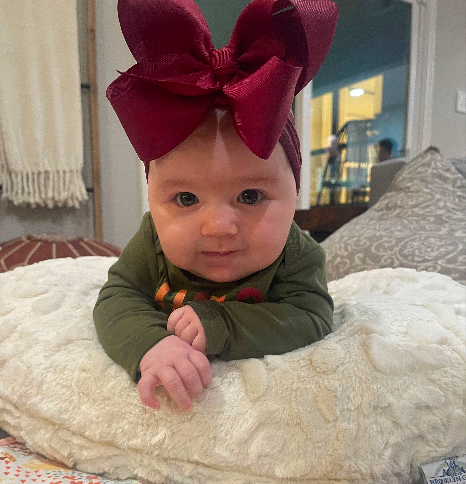 Hagan joined the competition — help win amazing prizes! baby, baby_toddler_clothing, cap, carmine, child, comfort, costume_hat, fashion_accessory, flooring, fun, hair_accessory, happy, head, headpiece, linens, magenta, party_supply, person, room, sleeve