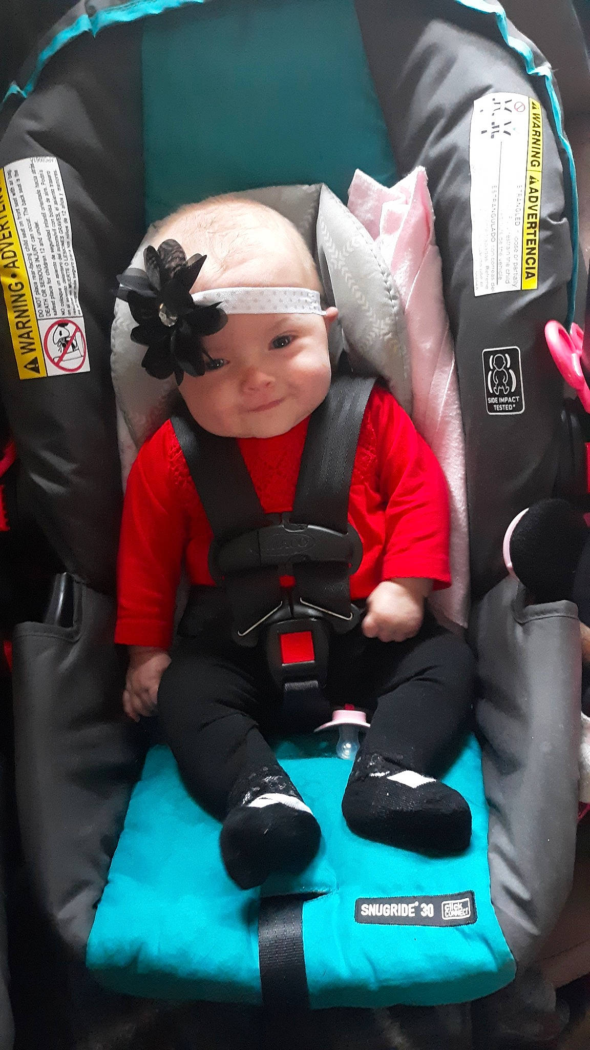 Lacy is registered to the contest to win money with this photo: baby_products, car_seat, child, comfort, person, personal_protective_equipment, product, red, toddler