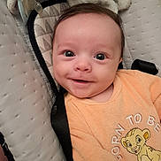 Gabriel a rejoint le concours — aidez-le/la à gagner de superbes lots ! baby, smiling, infant, face, eyes, clothing, orange_outfit, pacifier, plush_toy, seat, cushion, indoor, cute, child, portrait, happy, closeup, newborn, soft, comfort