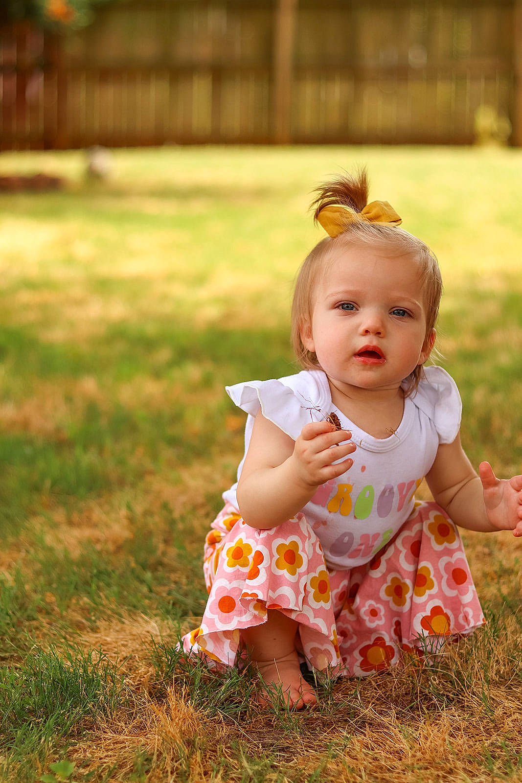 Daisie joined the competition — help win amazing prizes! baby, baby_toddler_clothing, child, dress, eye, face, flash_photography, fun, grass, grassland, happy, head, meadow, orange, people_in_nature, person, plant, skin, summer, sunlight