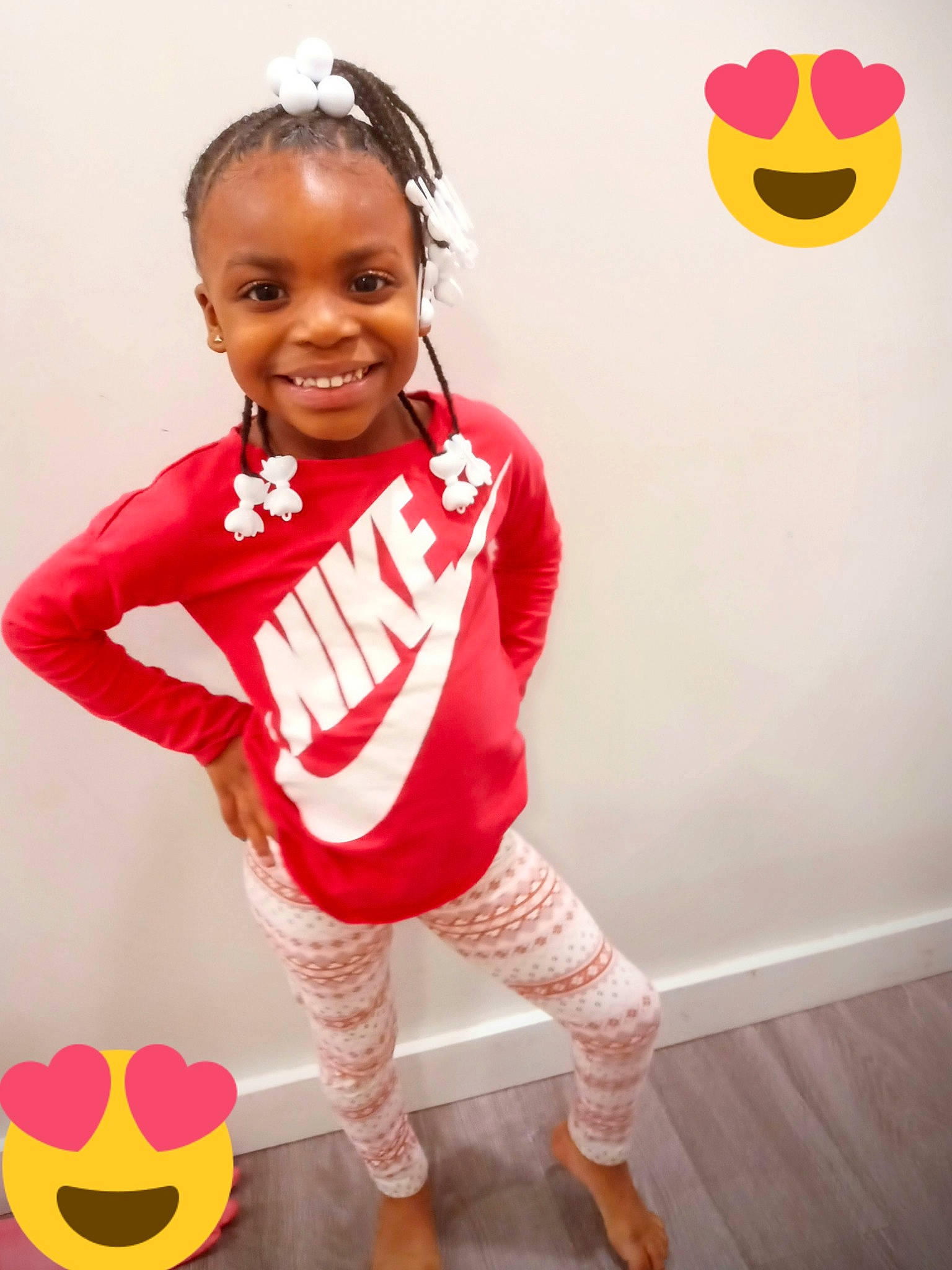 Jaida is registered to the contest to win money with this photo: arm, baby_toddler_clothing, face, flooring, happy, human_leg, joy, knee, orange, person, red, shoe, sleeve, smile, sneakers, sock, sportswear, standing, thigh, toddler