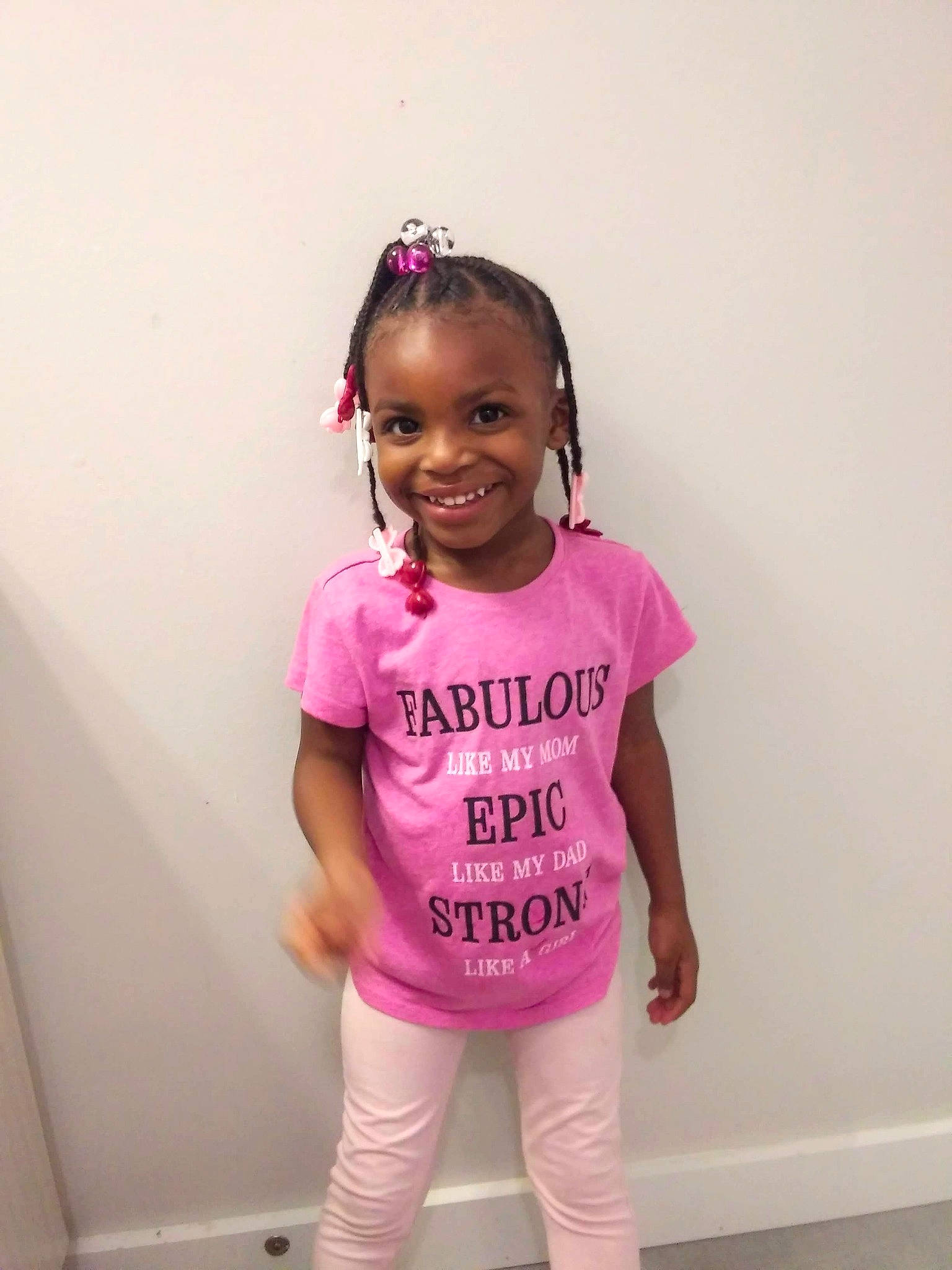 Jaida is registered to the contest to win money with this photo: active_pants, arm, baby_toddler_clothing, black_hair, cheek, clothing, cool, eye, face, hand, happy, head, human_body, joy, magenta, person, pink, purple, sleeve, smile