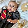 Aria joined the competition — help win amazing prizes! 4_months, baby, bed, child, clothing, costume, cute, glasses, golden_snitch, hand, harry_potter, headband, indoors, infant, lying_down, person, pillow, portrait, smile, tie