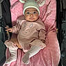 baby, infant, pink_blanket, bunny_hat, knitted_hat, stroller, cute, child, pink_clothing, socks, soft_texture, portrait, indoor, baby_girl, expression, wide_eyes, cozy, resting, small_hands, adorable