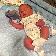 Alexandro joined the competition — help win amazing prizes! newborn, baby, sleeping, crib, blanket, plush_toy, elephant_toy, onesie, white_socks, baby_wipes, soft_toys, infant, resting, cozy, bed, nursery, cute, peaceful, indoor, child