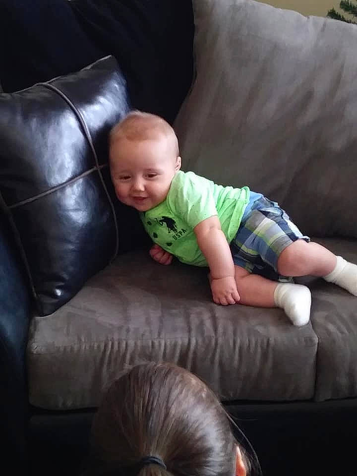 Jeremy is registered to the contest to win money with this photo: child, couch, day, fun, furniture, infant, nap, person, product, sitting, sleep, toddler