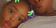 Elanii is registered to the contest to win money with this photo: child, woman, selfie, face, pout, filter, neon, devil_horns, beads, hair_accessory, couch, indoor, casual, portrait, closeup, happy, family, togetherness, fun, playful