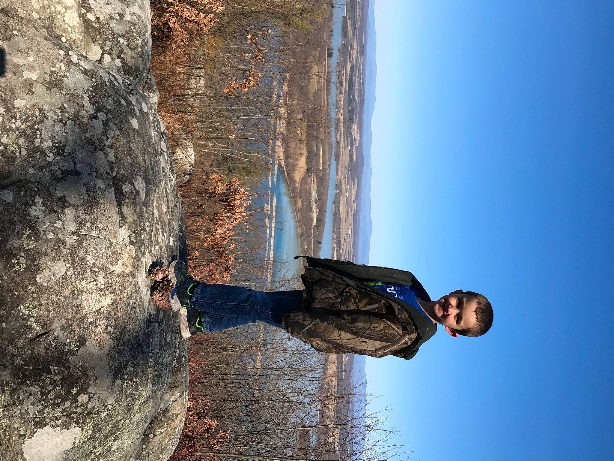 Antonio is registered to the contest to win money with this photo: adventure, fun, jeans, joy, person, photography, recreation, rock, tree, water