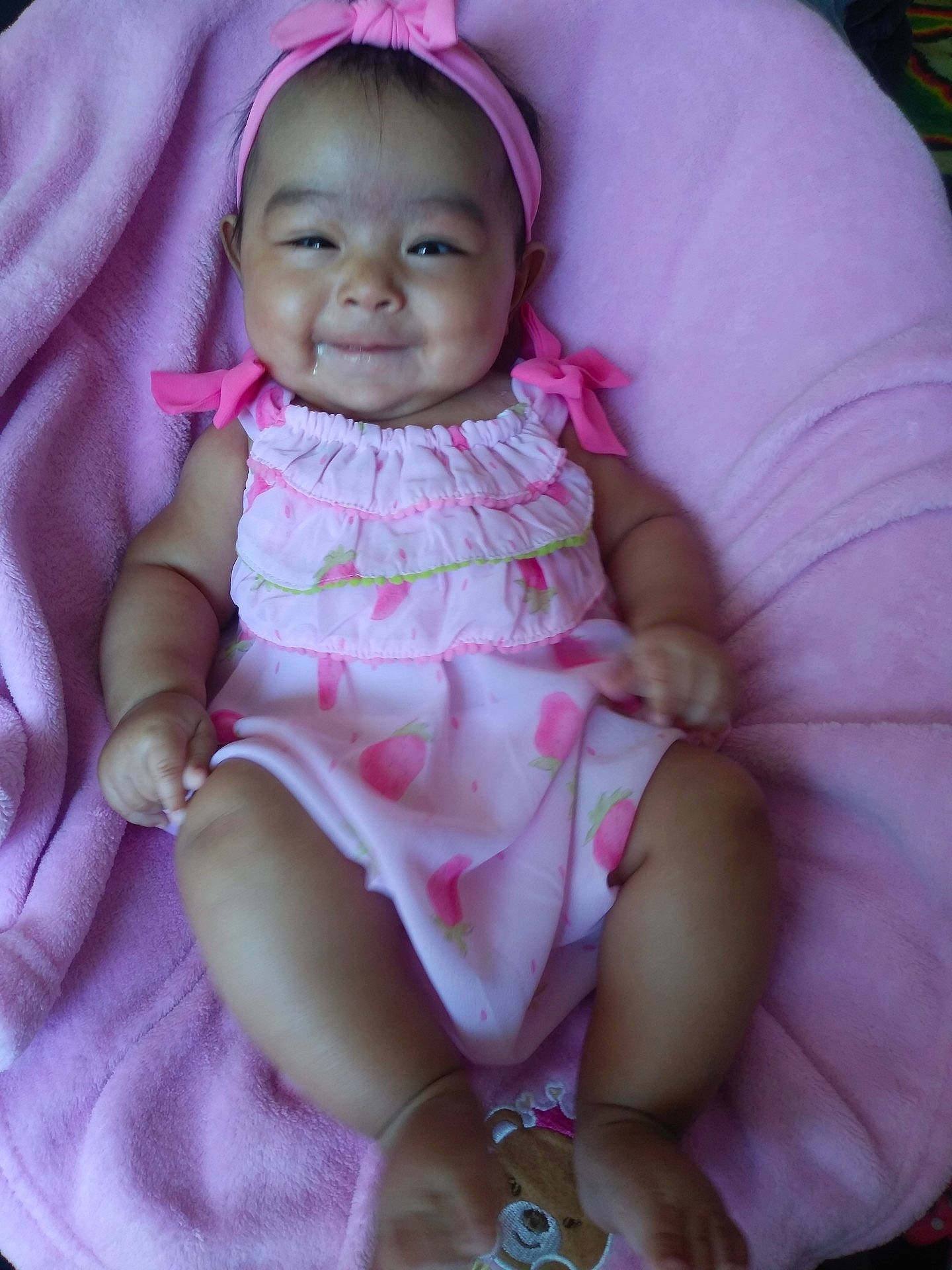 Aleena is registered to the contest to win money with this photo: abdomen, cheek, child, eye, face, girl, head, infant, iris, joy, mouth, person, pink, product, purple, skin, smile, toddler