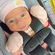 Dianna joined the competition — help win amazing prizes! baby, infant, car_seat, hat, mittens, pink_clothing, rainbow_patch, straps, safety, child, cute, young, portrait, seatbelt, adorable, face, expression, newborn, indoor, closeup